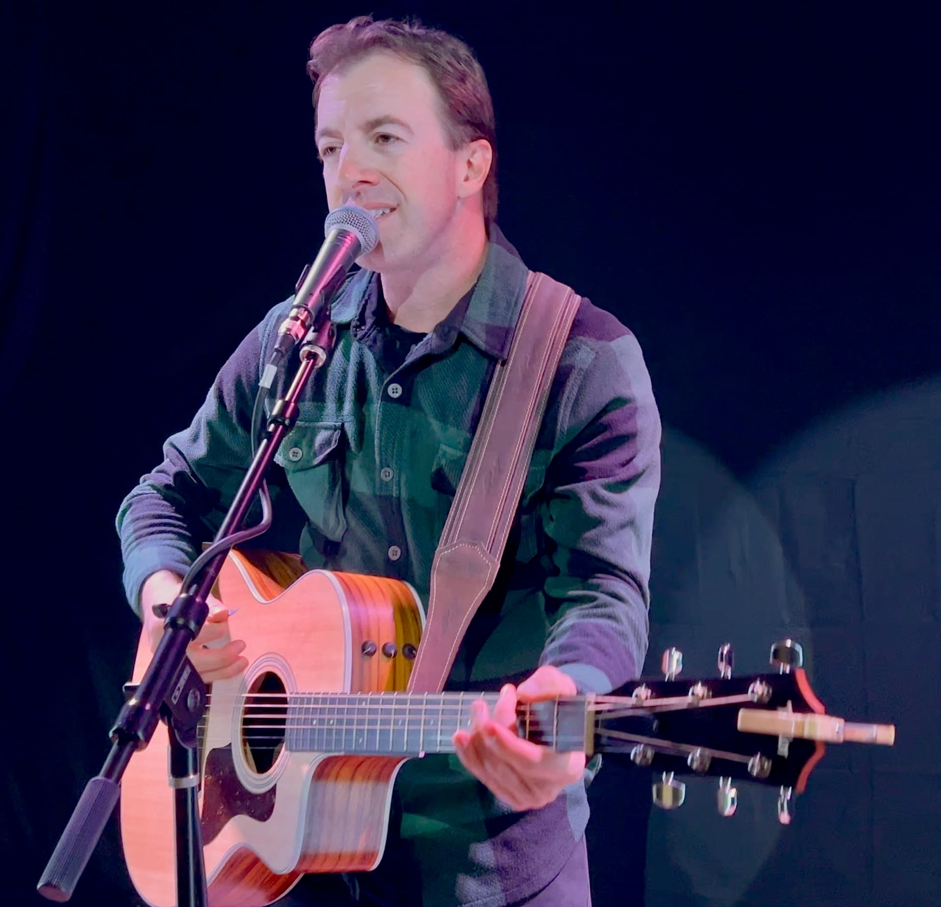 Nik Mathews performing solo acoustic